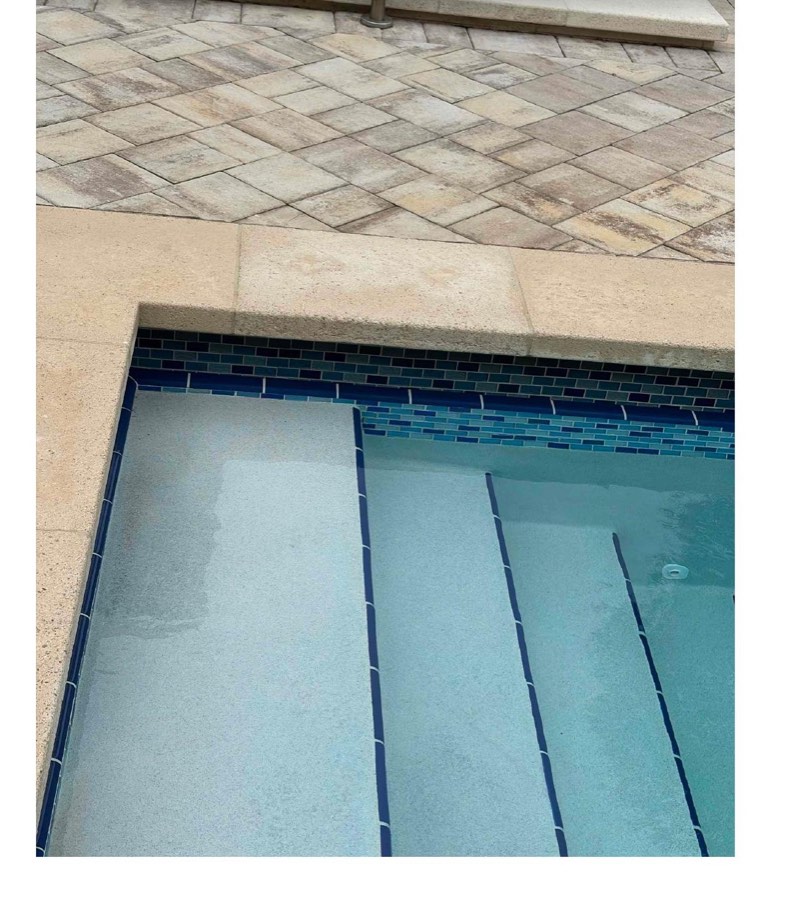 The same pool corner and coping, clean after chemical treatment